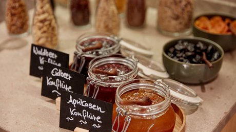 Pictures of a dream holiday in Bad Tölz Jars of wild berry, strawberry and apricot jam on a table
