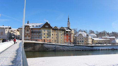 Pictures of a dream holiday in Bad Tölz Winter view of colorful houses and river in a small town