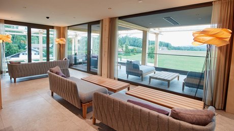 Pictures of a dream holiday in Bad Tölz Modern lounge with armchairs, sofas and large window to terrace and landscape