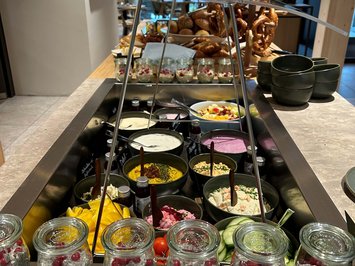 Board and restaurants Assorted yogurts, chia seeds, and pretzels on a buffet in a restaurant