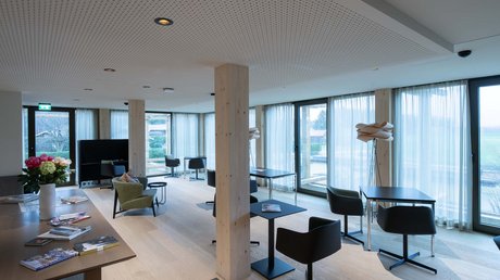 Pictures of a dream holiday in Bad Tölz Modern lounge area with tables, chairs, and large panoramic windows