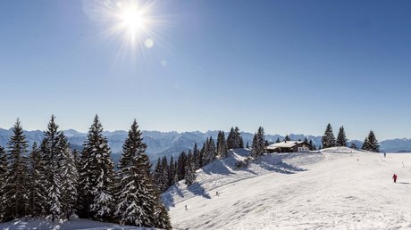 Pictures of a dream holiday in Bad Tölz Winter landscape with snow-covered trees, mountains, and sun in a clear sky