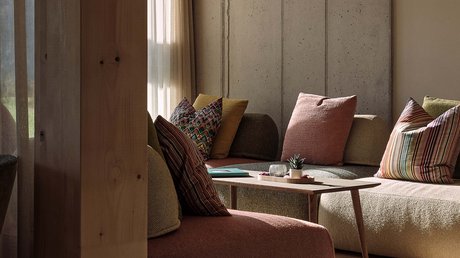 Pictures of a dream holiday in Bad Tölz Cozy living room with sofas, colorful pillows, and wooden pendant light