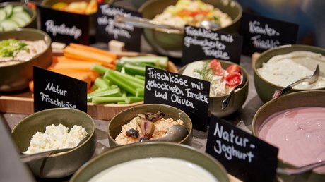 Pictures of a dream holiday in Bad Tölz Various cream cheese and yogurt varieties with vegetable sticks at buffet