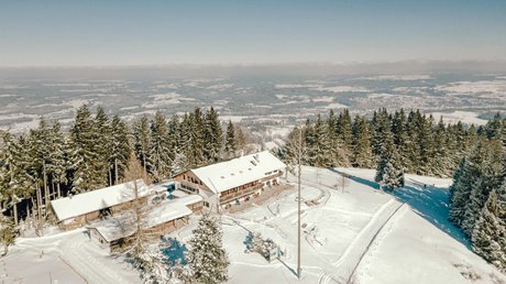 Pictures of a dream holiday in Bad Tölz Snow-covered alpine lodge with snowy landscape and forest in winter
